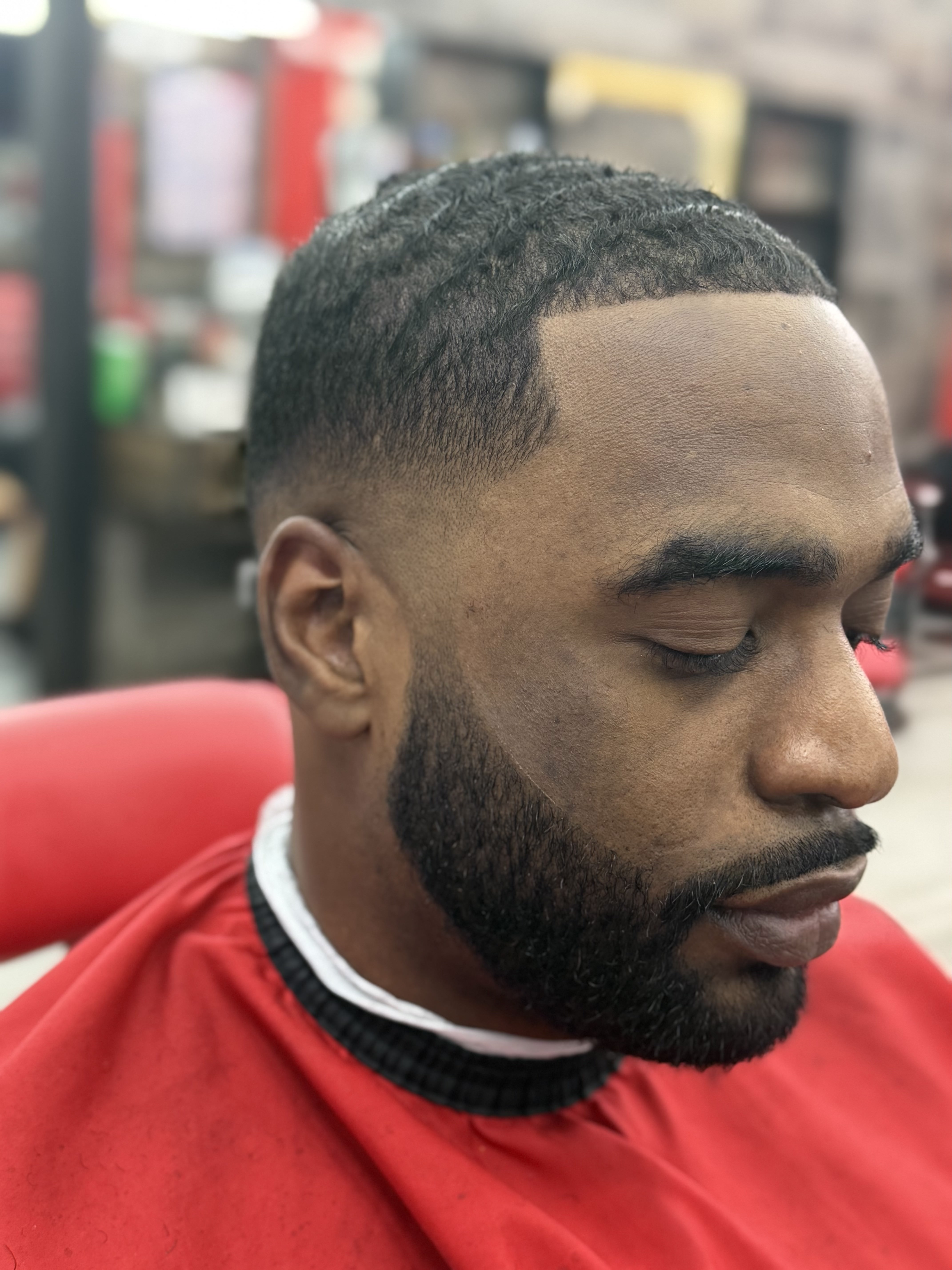 Mid fade with shaped beard